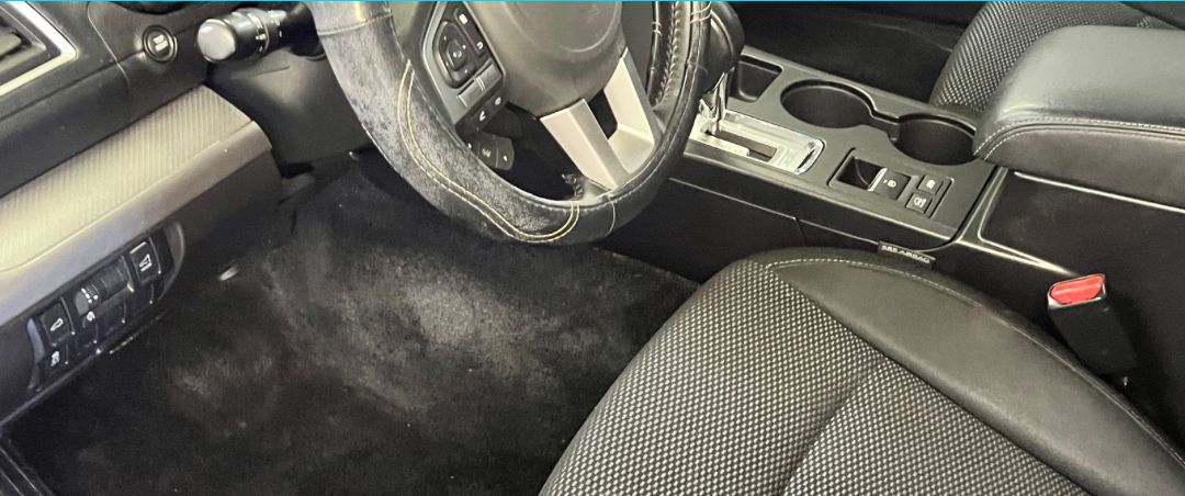 The same footwell after In the Details Auto Spa cleaned it