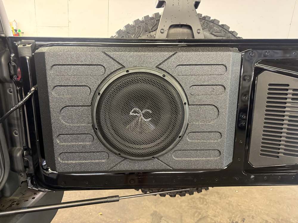 Subwoofer box in a tailgate by In the Details Auto Spa, Allison Park