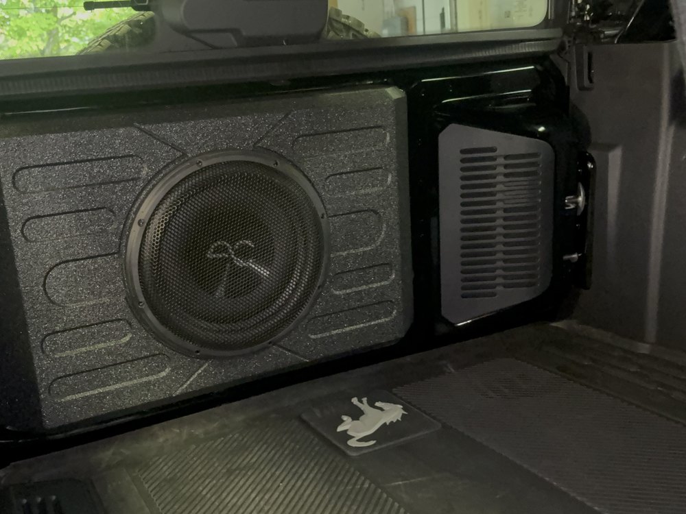 Subwoofer in a truck bed by In the Details Auto Spa, Allison Park
